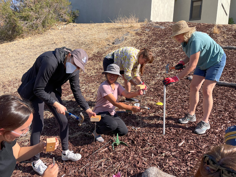 Students Assembling the Poles for the Flowers